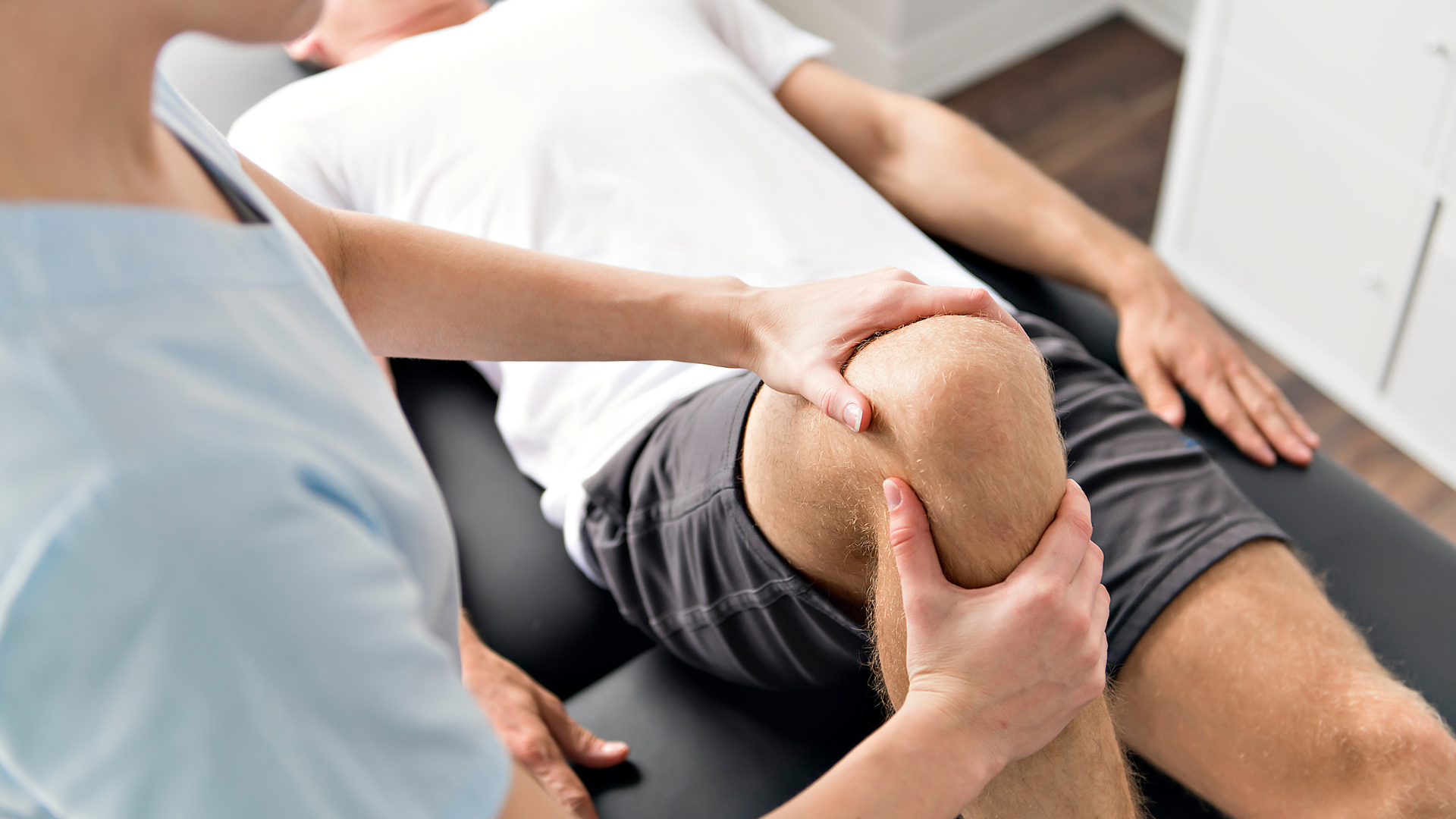 Man receiving physiotherapy for chronic pain